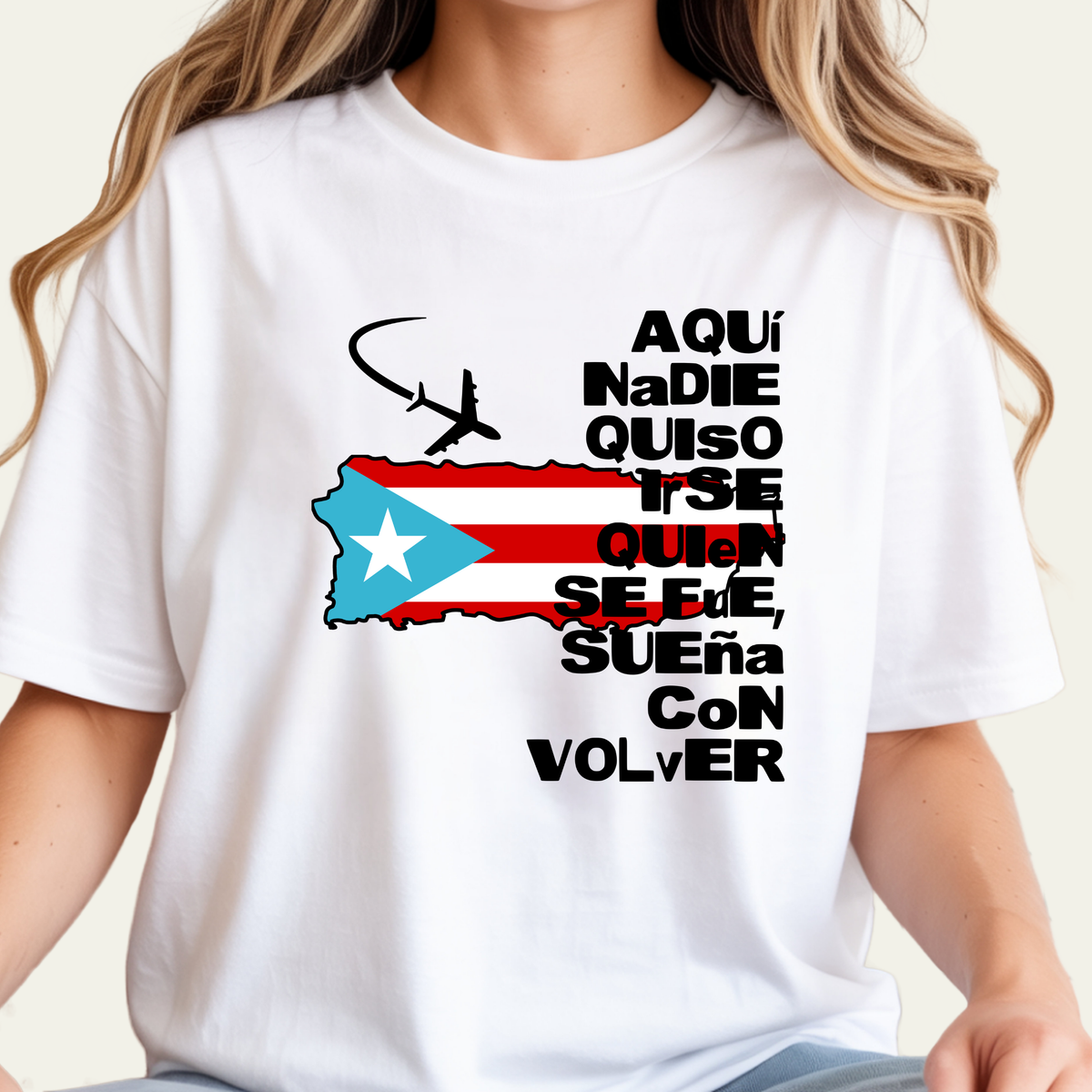 A woman wearing a white graphic t-shirt featuring a Puerto Rican flag design with a silhouette of an airplane and Spanish text.