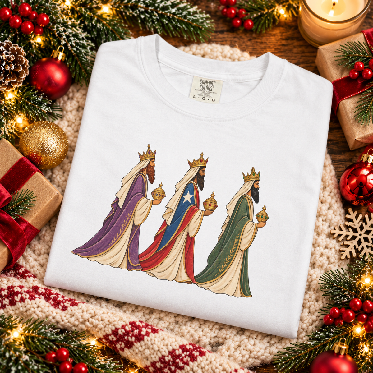 Festive holiday flat lay of folded White Reyes Magos tee